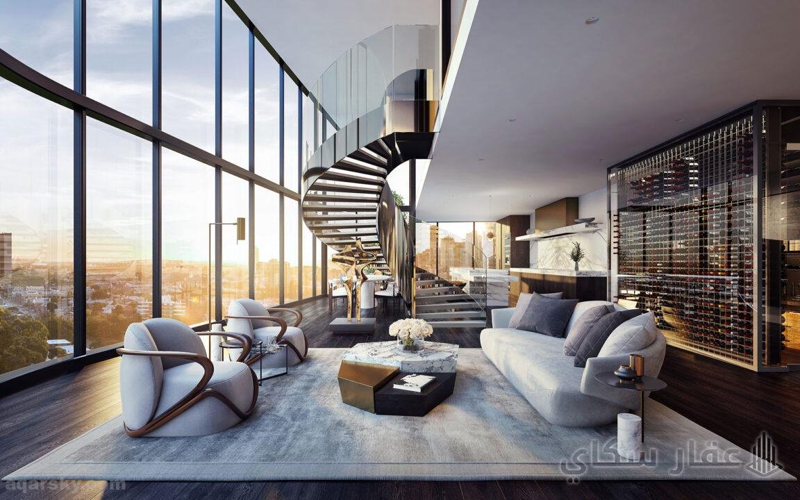 تصميم بنتهاوس a room with a spiral staircase and a couch